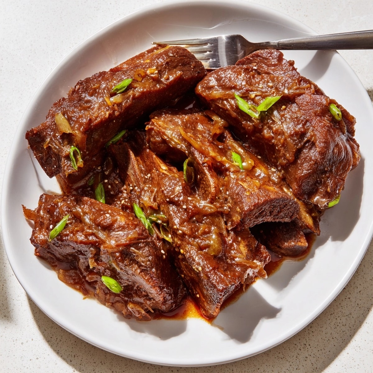 Close-up shows glistening Beef Short Ribs Marinade ingredients: soy, sesame oil, aromatics.