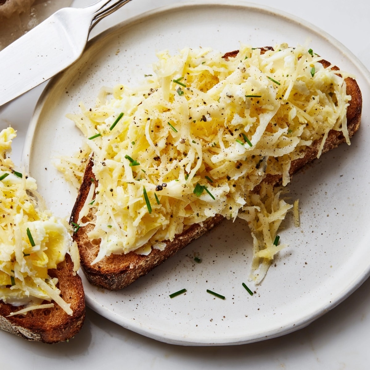 Close-up of Grated Egg Toast: rich, simple breakfast perfection, ready to be enjoyed.