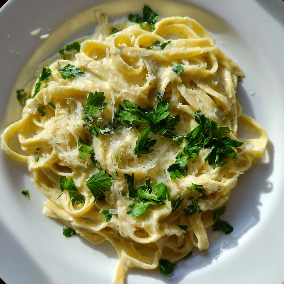 Creamy Garlic Parmesan Pasta, glistening with Parmesan, ready for a comforting plate of Italian goodness.