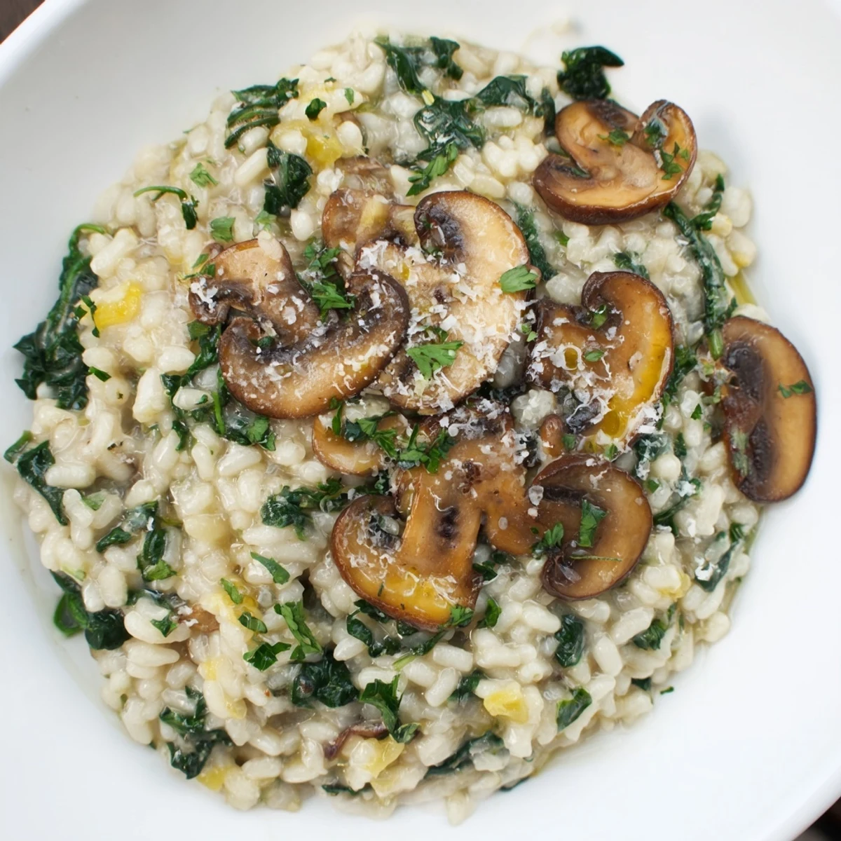 Earthy mushrooms and vibrant spinach star in this delicious, creamy Italian risotto.