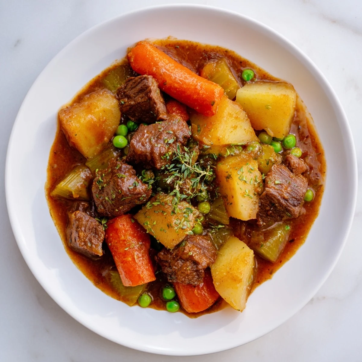 Hearty beef stew, with visible carrots and potatoes, promising a warm, comforting meal.