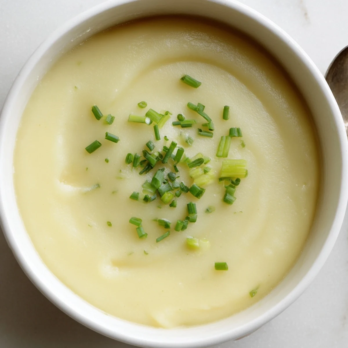 Golden swirls and steam rise from this warm and comforting creamy leek and potato soup.