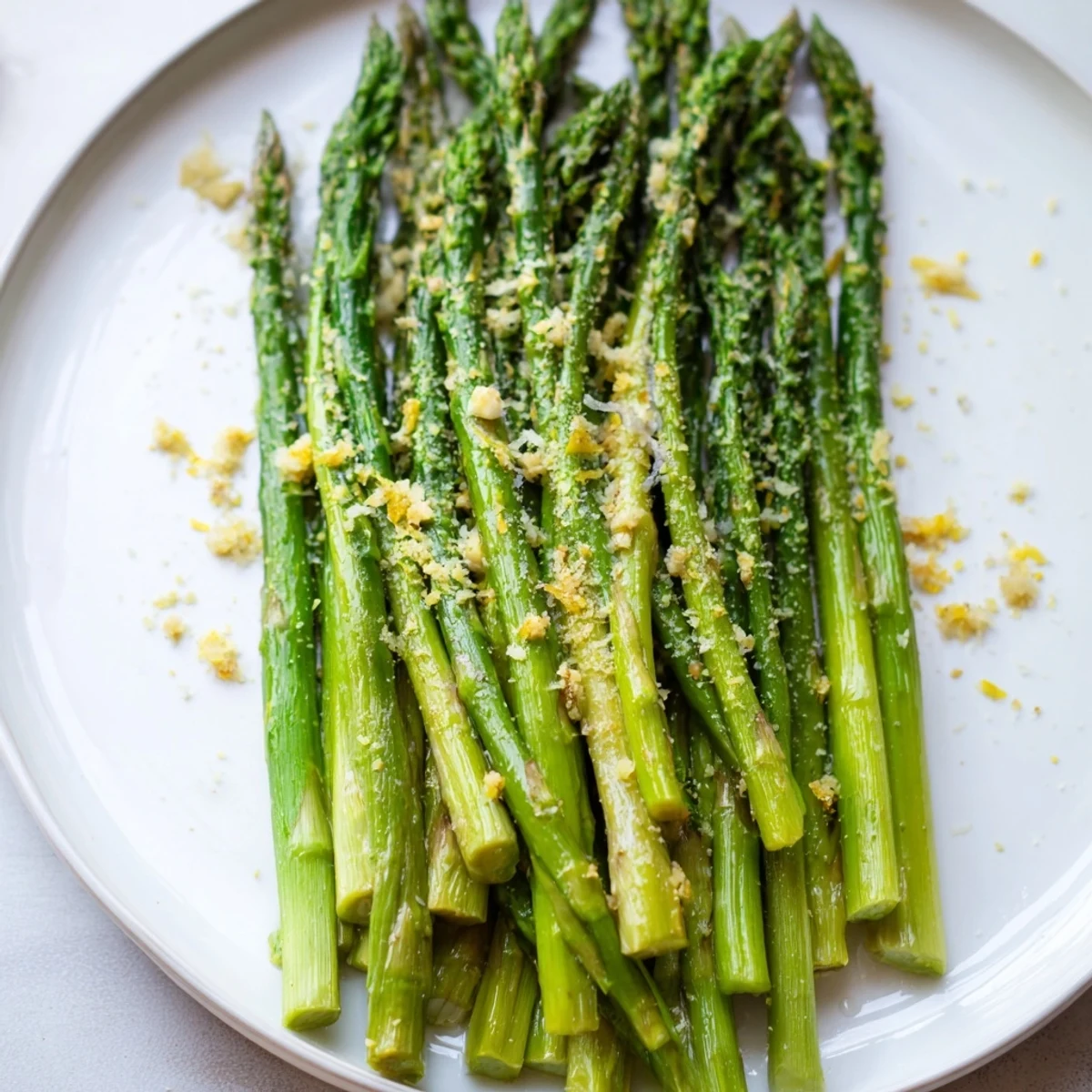 Enjoy this healthy plate of Lemon Garlic Asparagus with Parmesan, bursting with lemon and garlic flavors.