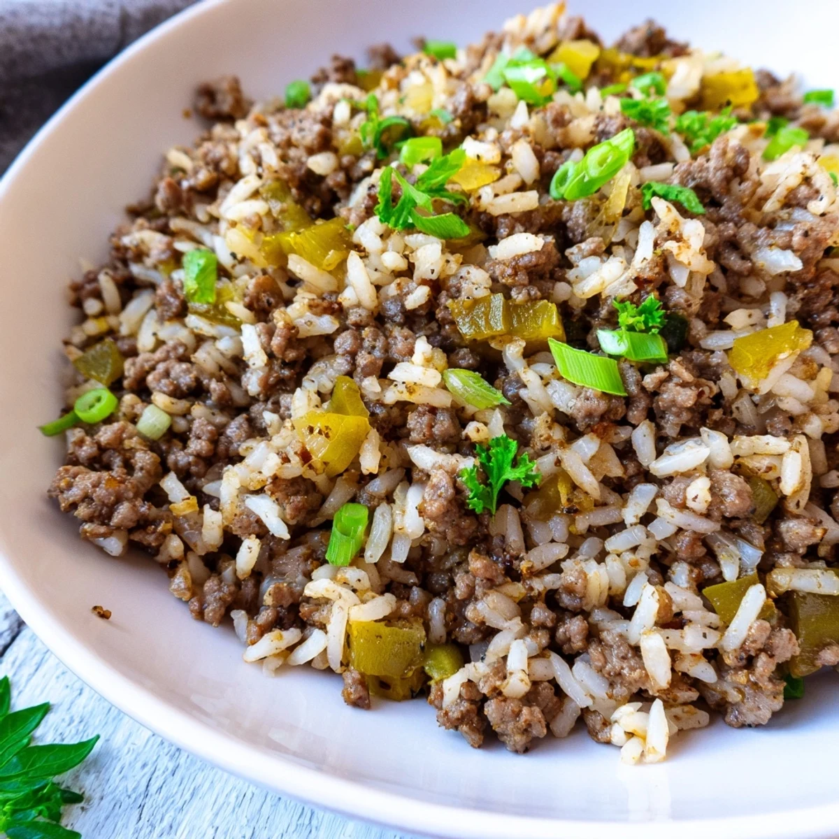 Close-up of Cajun Dirty Rice with ground beef, highlighting tender grains and savory spices.