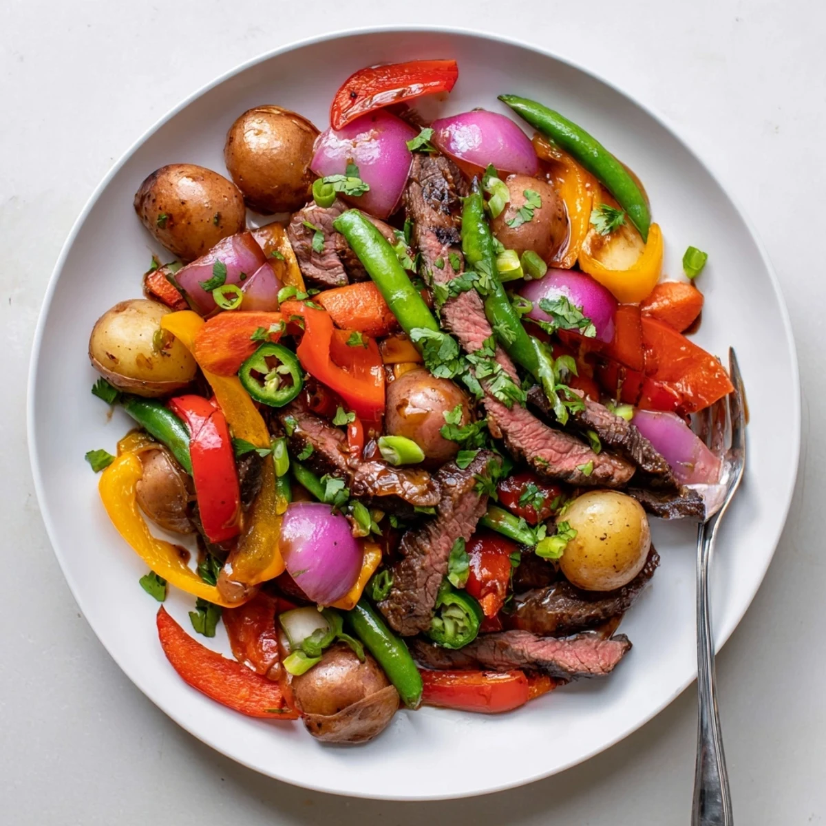 Sizzling Blackstone Cowboy Stir Fry Dinner features seared beef and vibrant vegetables with smoky aroma. 