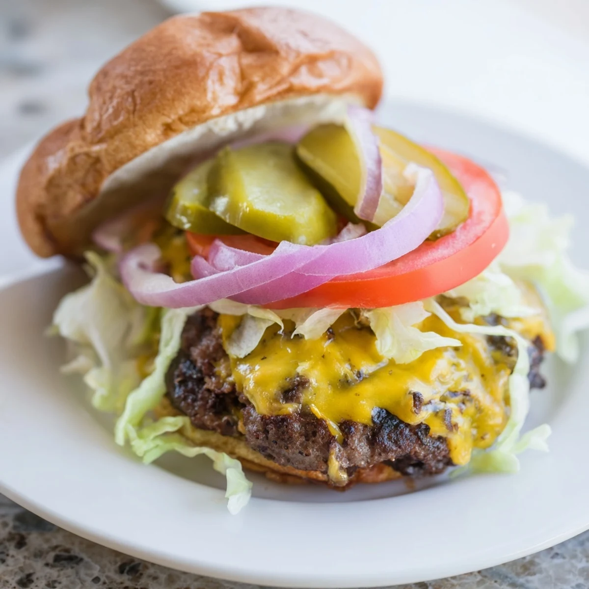 Golden juicy smash burger with melted American cheese on toasted brioche bun