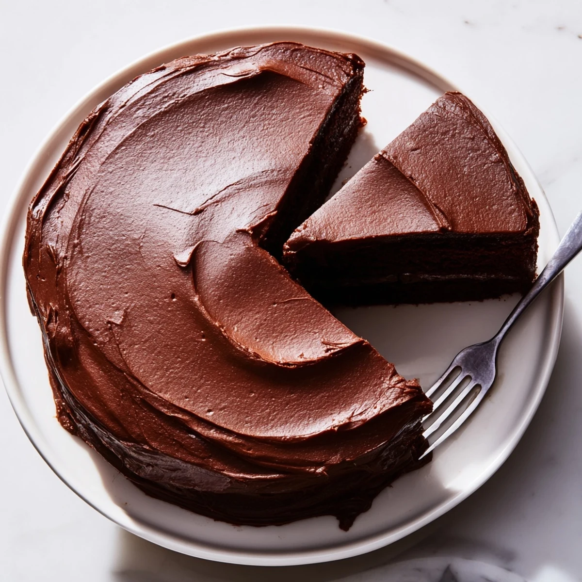 Decadent chocolate cake with silky frosting, topped with fresh berries for special occasions