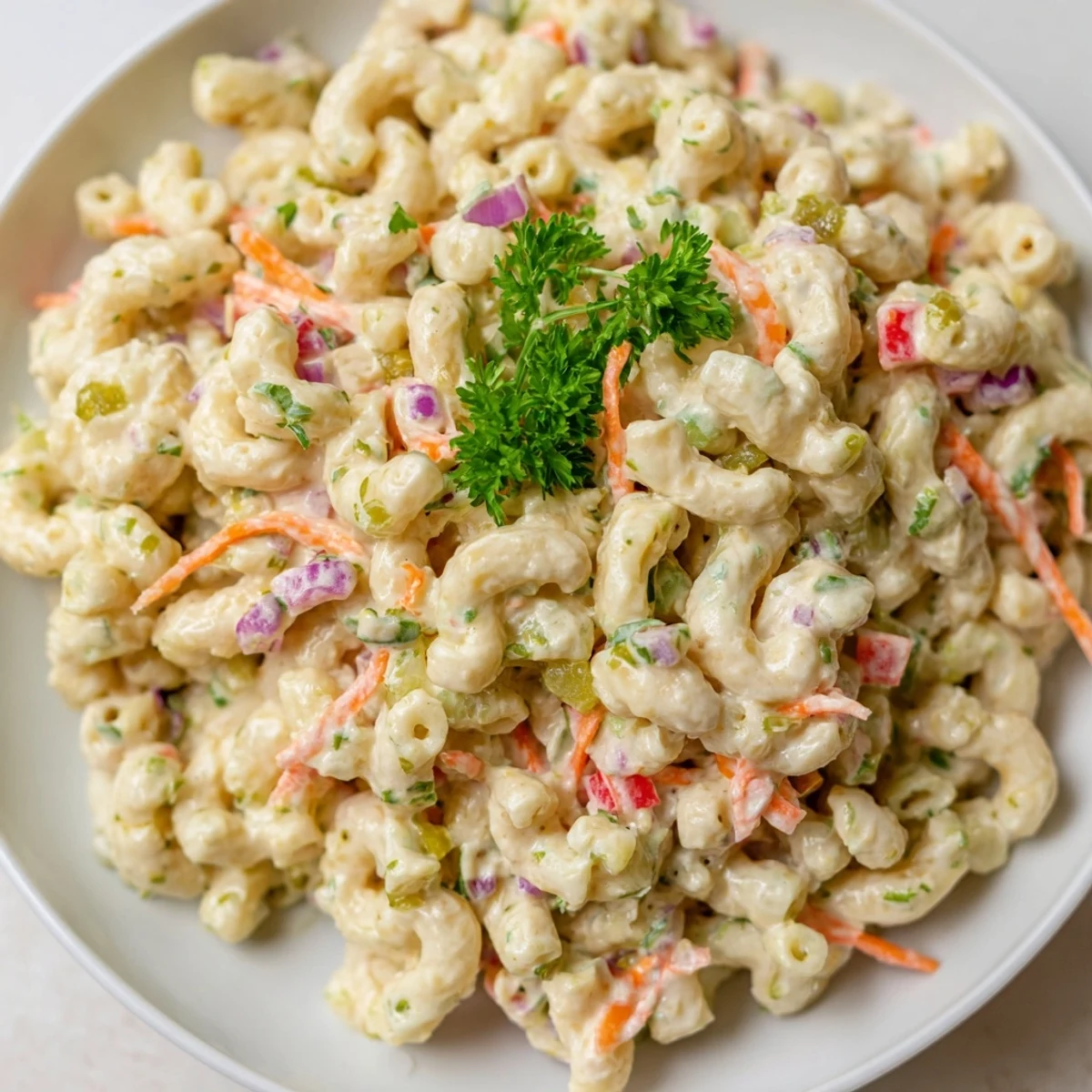 Classic tangy and creamy macaroni salad featuring tender pasta coated in white mayonnaise-based sauce
