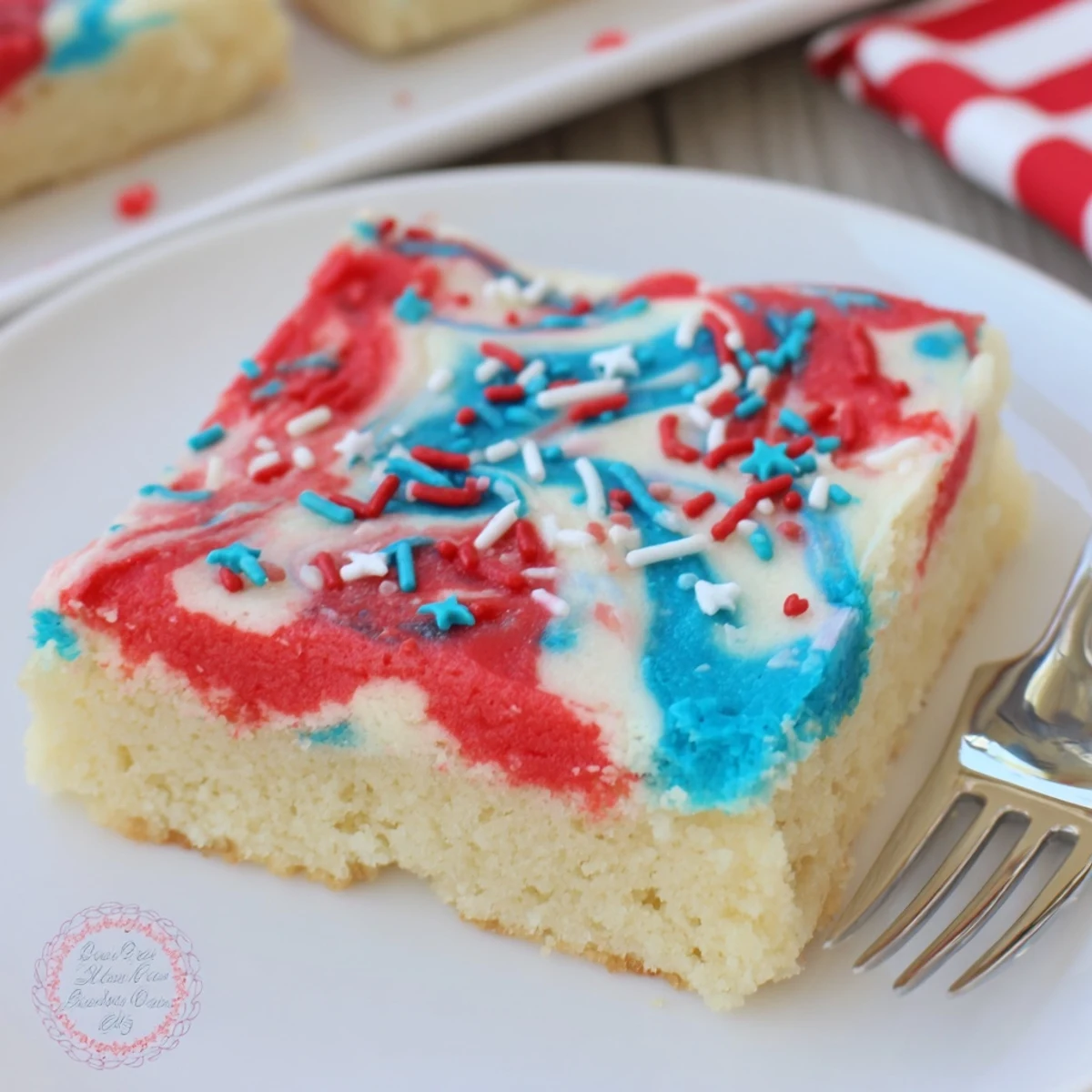 Patriotic Sugar Cookie Bars 4th Of July Dessert Recipe—soft buttery bars, swirled frosting