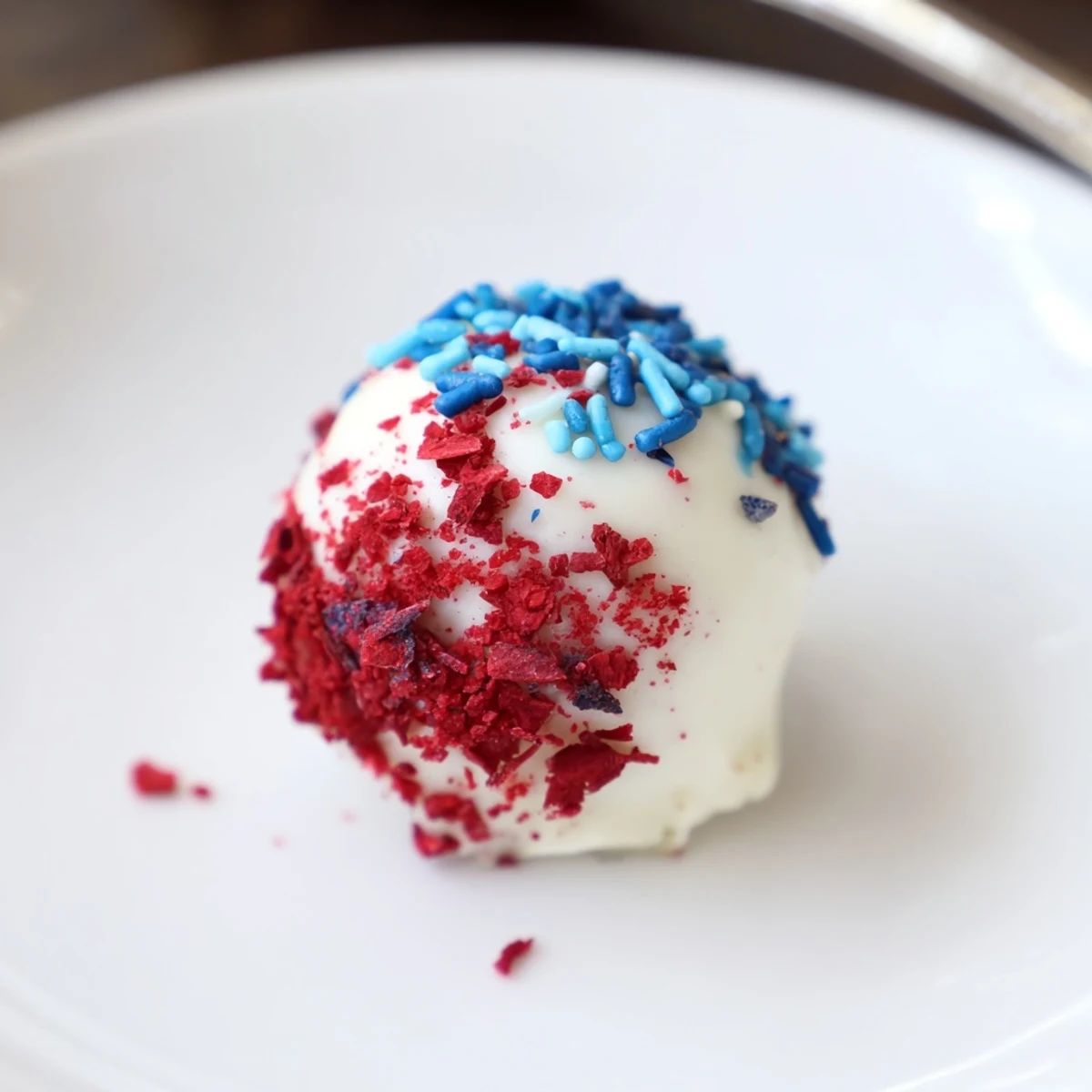 Plate of Of July Truffles Creamy And Patriotic arranged with white sugar