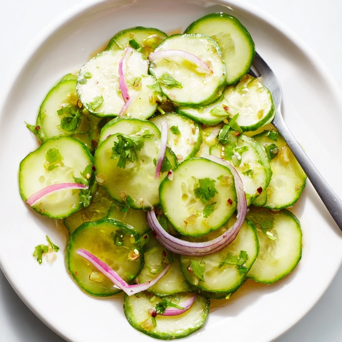 Refreshing Honey Lime Cucumber Salad bowl featuring thinly sliced vegetables drizzled with zesty lime honey glaze