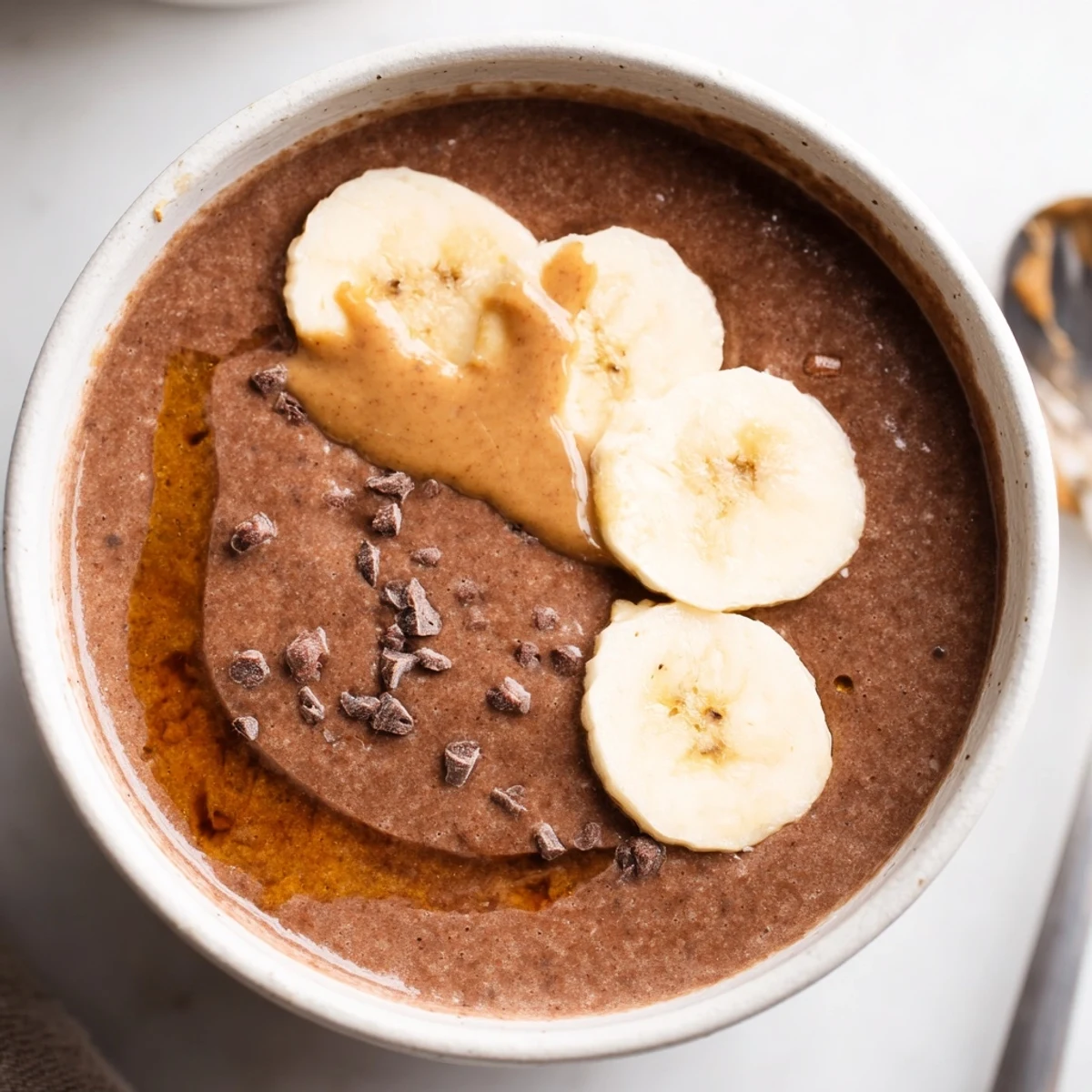Breakfast ready Chocolate Peanut Butter Banana blend with frothy top and aroma
