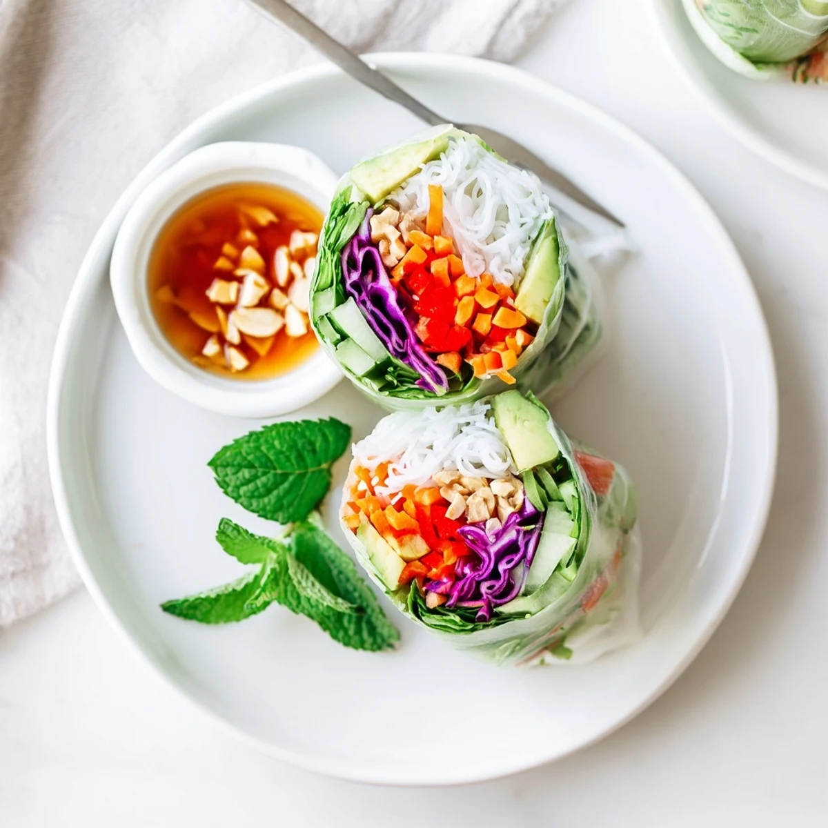 Bright Gluten Free Vegetable Spring Rolls wrapped in translucent rice paper, fresh herbs visible