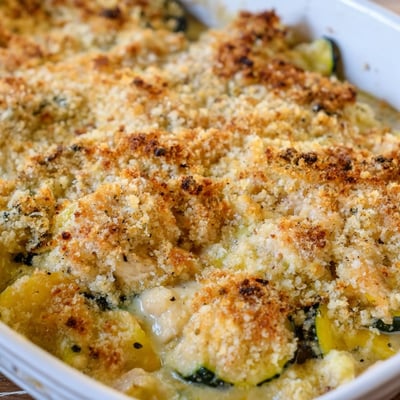 Overhead shot of a hearty Chicken Zucchini Bake served in a white dish, perfect for a wholesome family dinner.